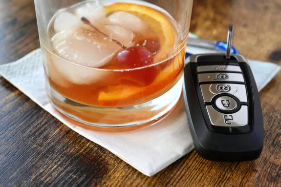 A mixed drink liquor cocktail with key fob for vehicle